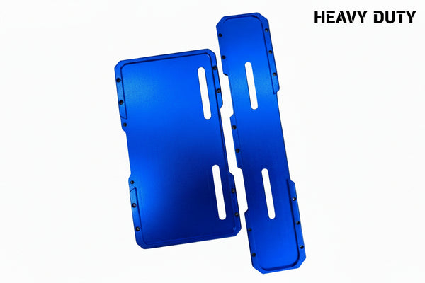 Two bright blue anodized metal parts, likely protective covers or panels, displayed on a bubble wrap background.