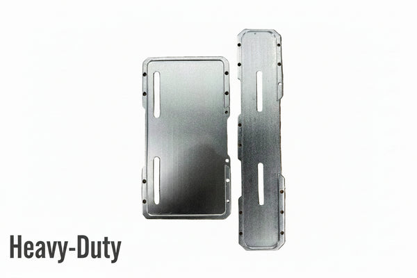Two brushed metal mounting plates with pre-drilled screw holes and cutouts, displayed on a brown textured bubble wrap background.