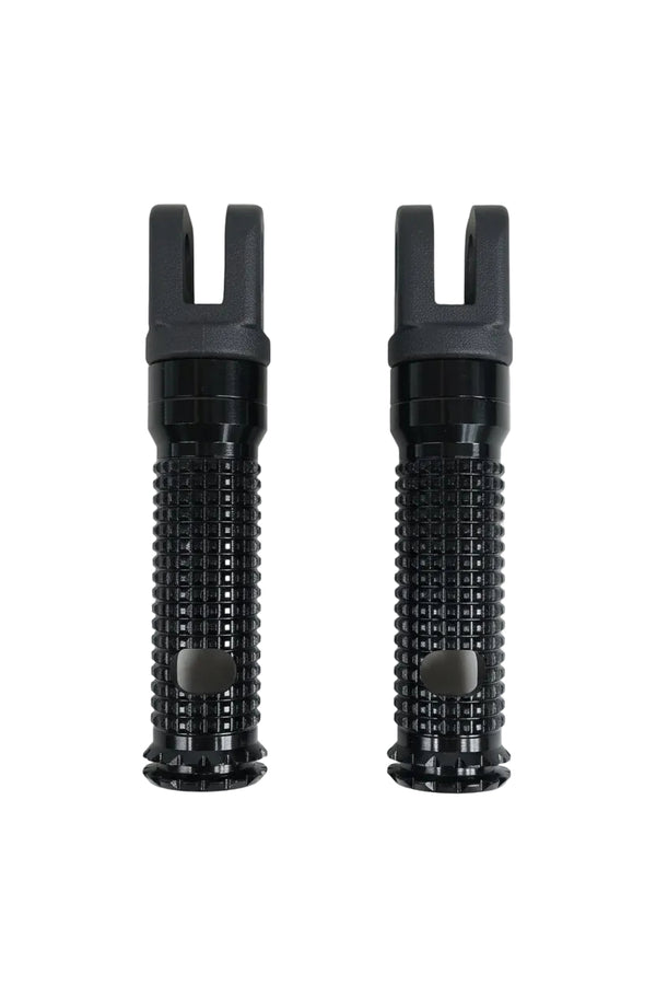 Two black textured handlebar grips with fork-shaped ends, displayed side-by-side on a light wood grain surface.