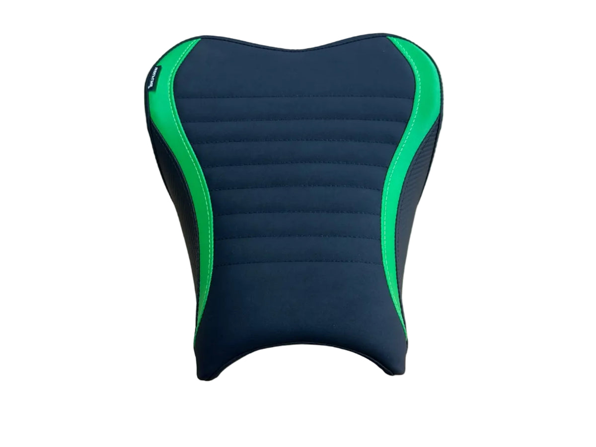 A motorcycle or scooter seat cover with a black ribbed center and bright green piping accents, shown on a light wood tabletop.
