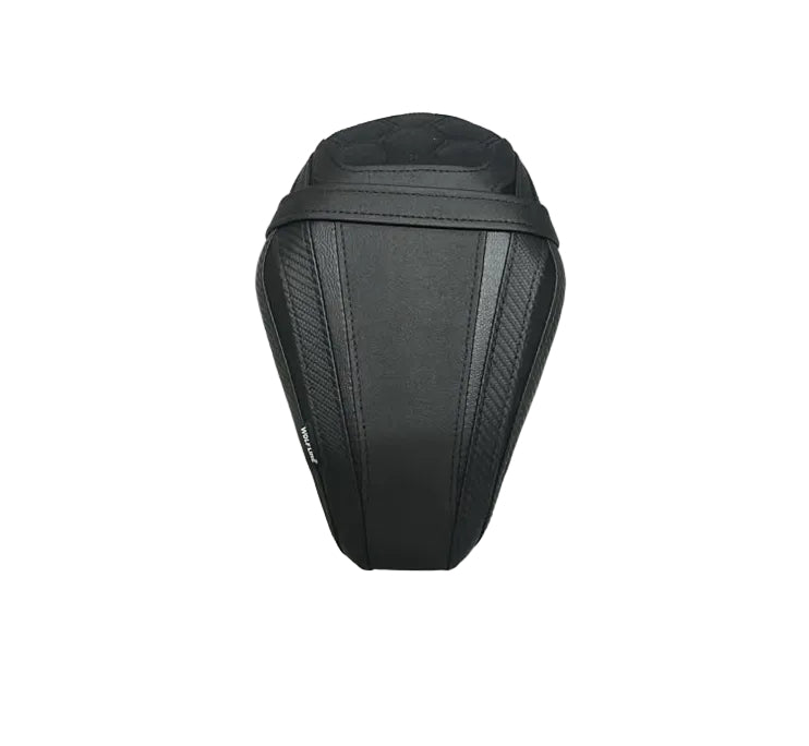 A black motorcycle or scooter seat cover resting on a white protective sheet, with cardboard boxes visible in the background.