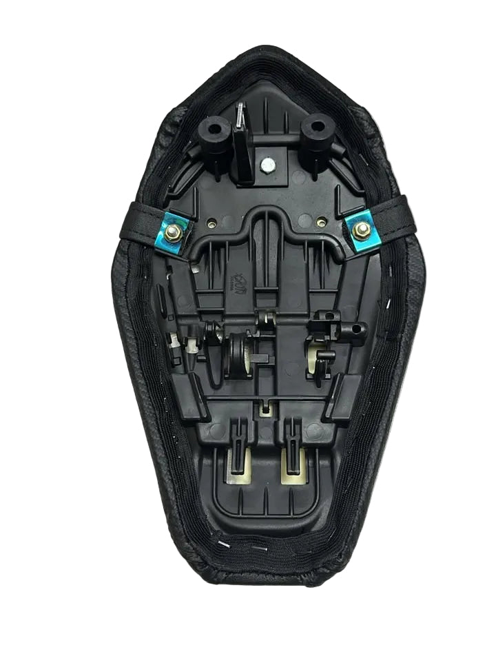 A black motorcycle or scooter seat cushion with its internal mounting hardware and straps visible, placed on a white textured surface.