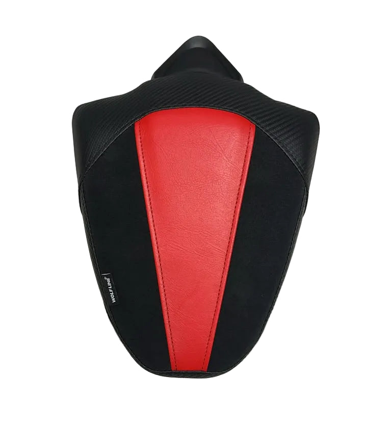 A motorcycle or scooter seat pad with a black body and a prominent red center panel, resting on a white sheet.
