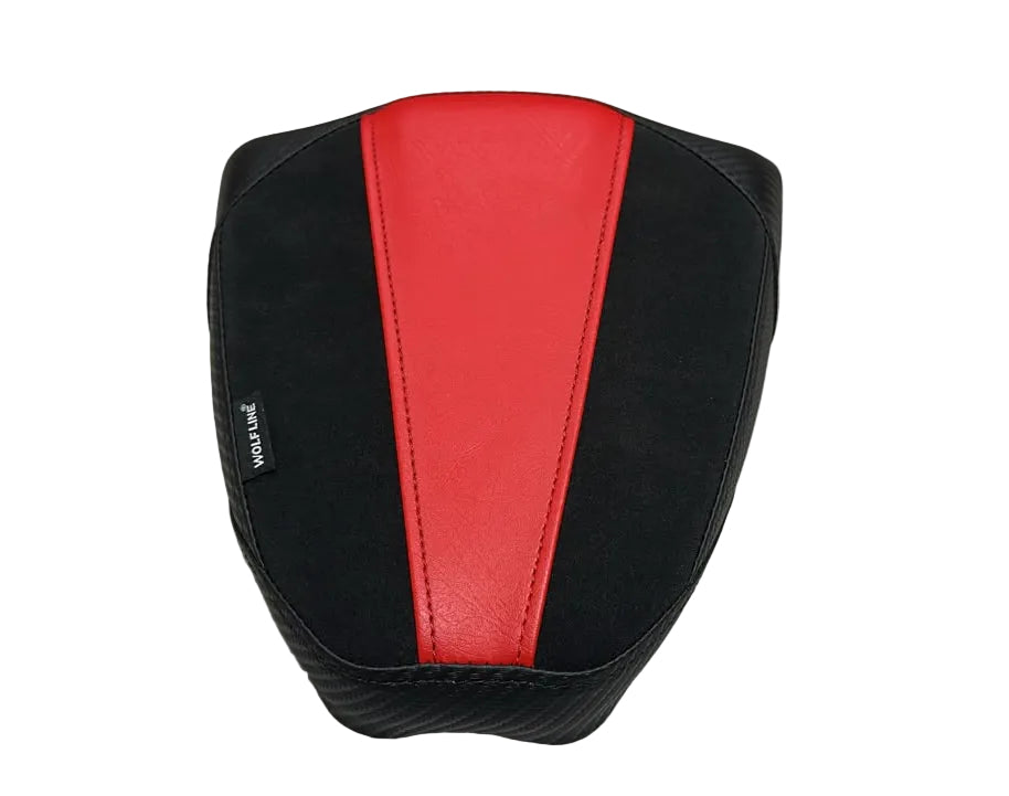 A motorcycle or scooter seat cover with a black and red design, placed on a white plastic sheet.