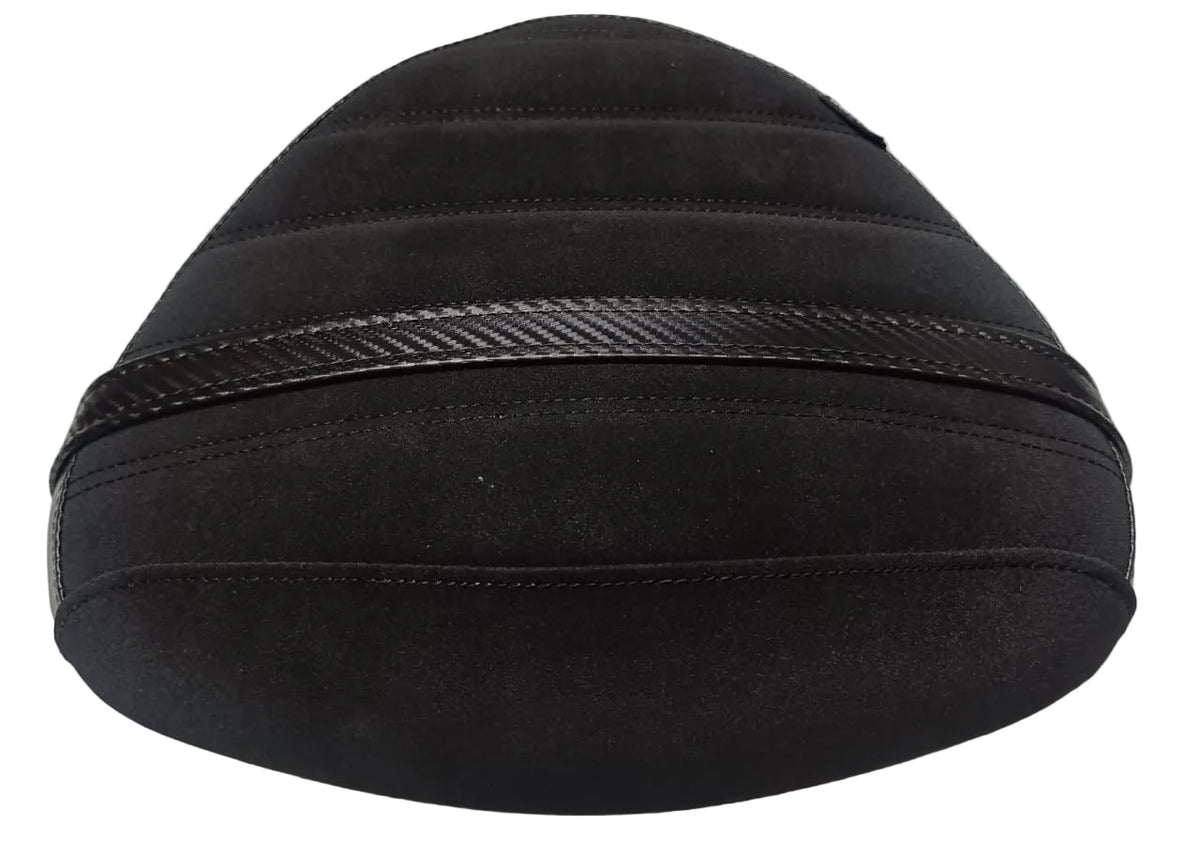 A black motorcycle or scooter seat cover with horizontal stitched channels and a textured black accent band, shown on a light fabric background.