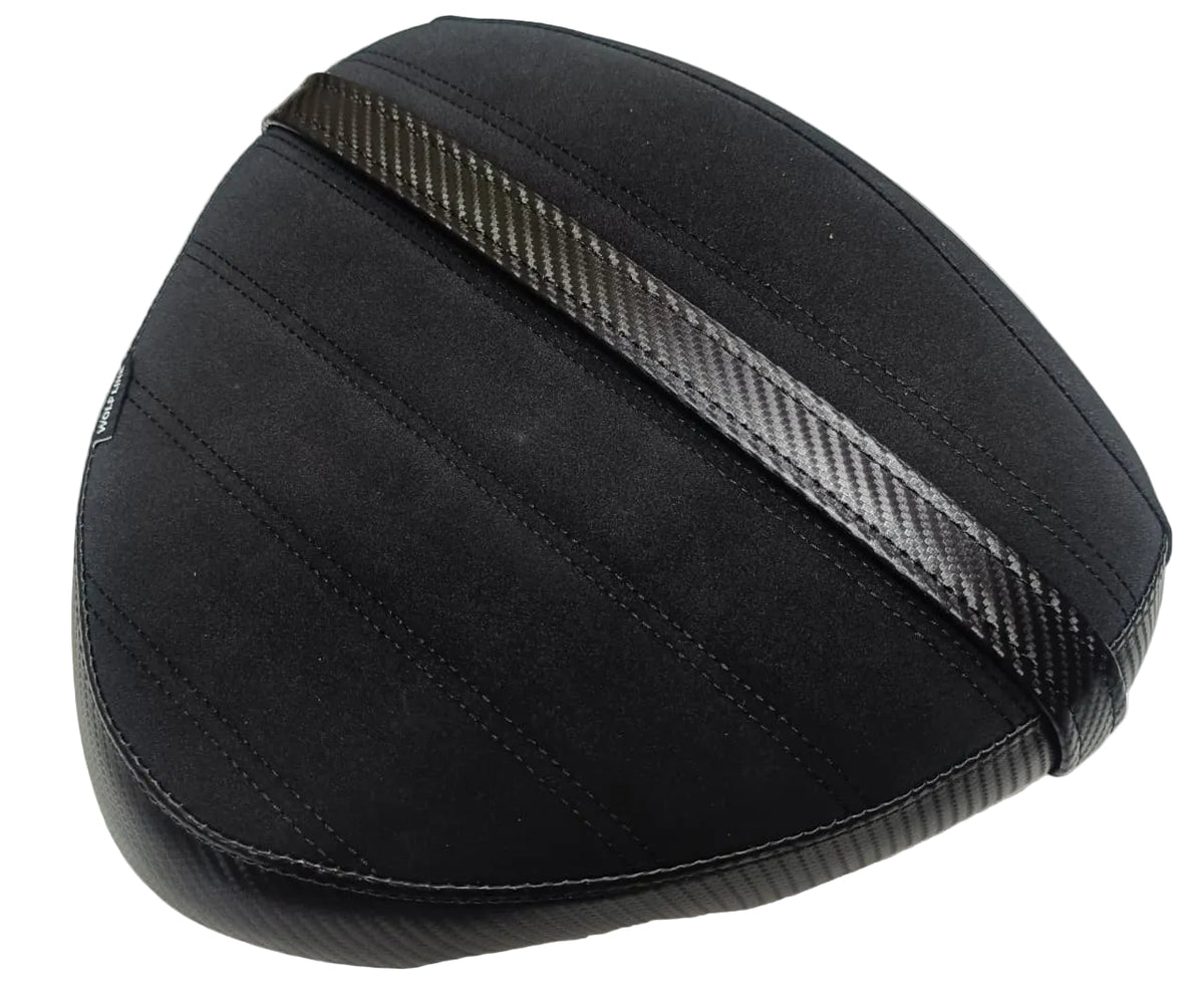 A black motorcycle or scooter seat cover with a carbon fiber pattern trim, shown on a light-colored surface.