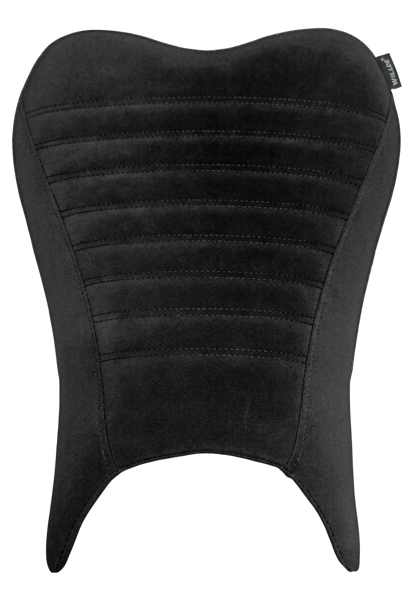 A black motorcycle or scooter seat pad with horizontal stitched channels, laid flat on a light-colored fabric surface.