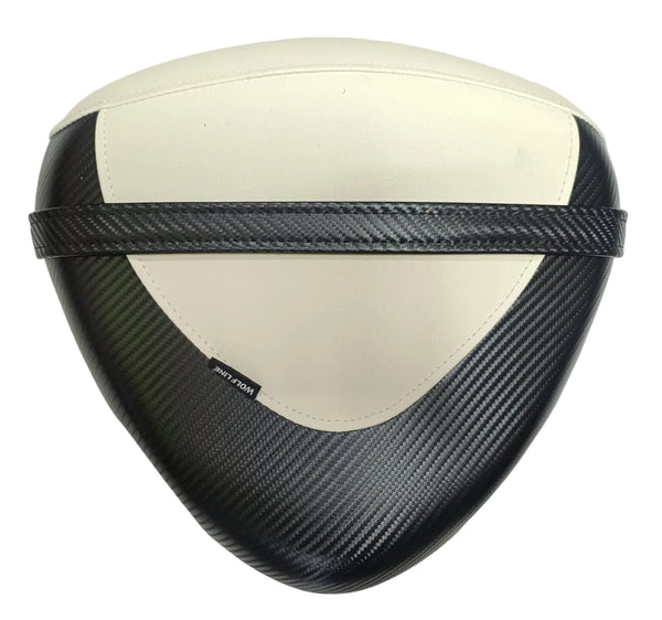 Triangular motorcycle or scooter seat cover with a black carbon fiber weave pattern and a cream-colored center panel, featuring a black carbon fiber strap across the middle.