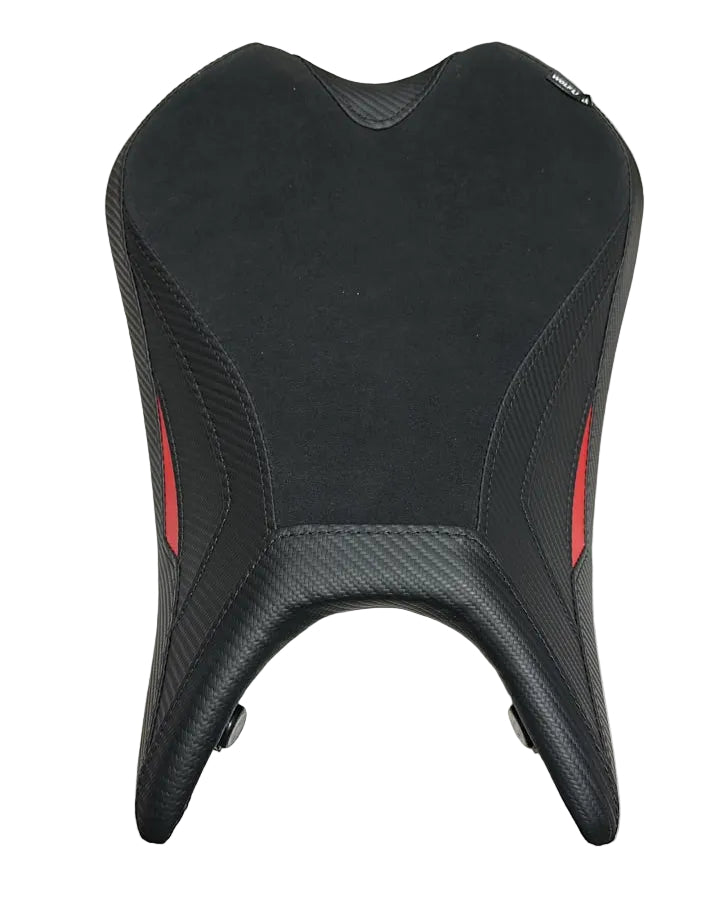 A black motorcycle or scooter seat cover with textured carbon-fiber-style side panels and small red accent stripes, laid flat on a white sheet.