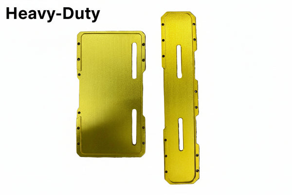 Two bright yellow anodized metal protective covers or plates with pre-drilled screw holes and slot cutouts, displayed on a textured gray bubble wrap background.